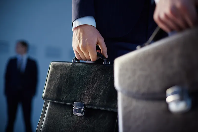 lawyer holding a briefcase.