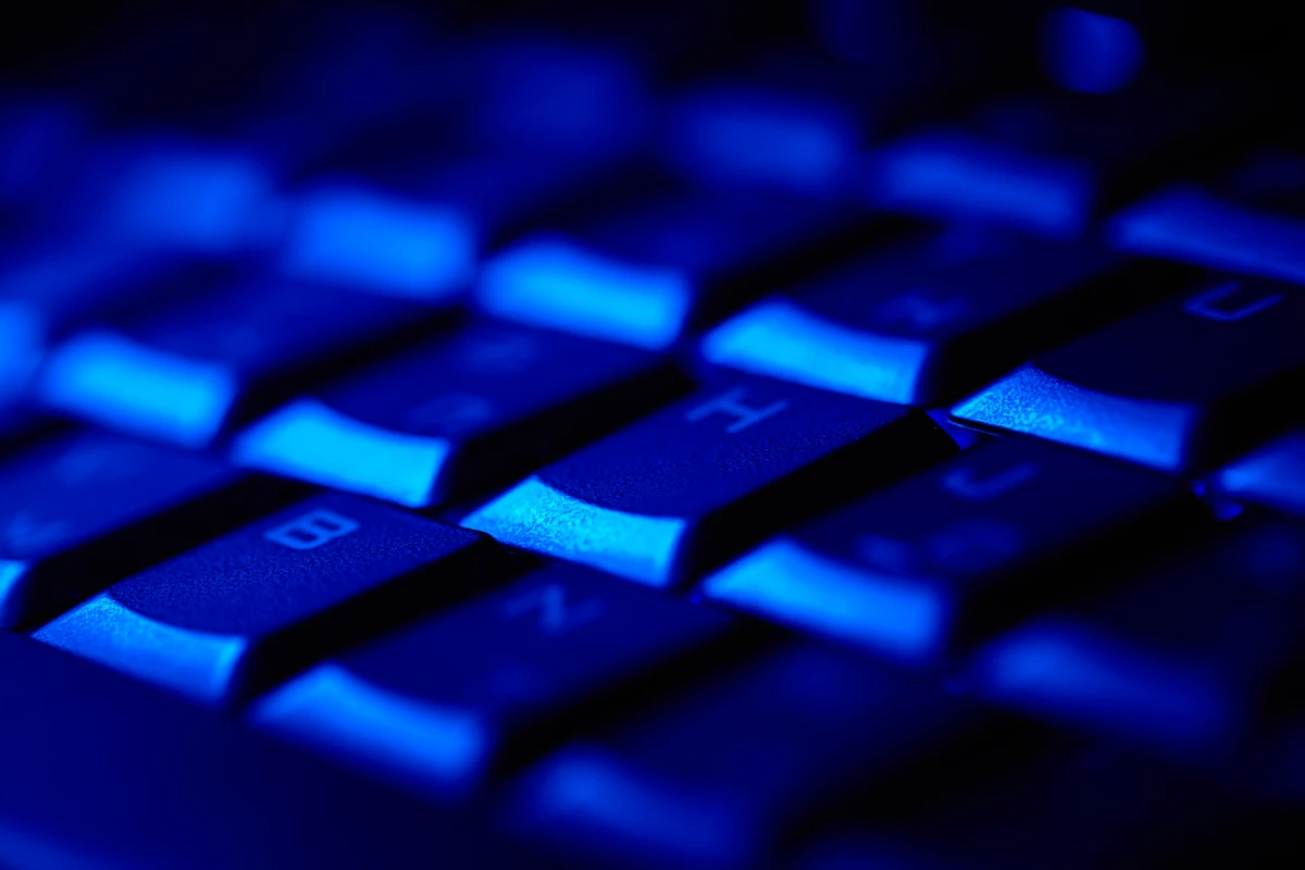 computer keyboard in a dark room.